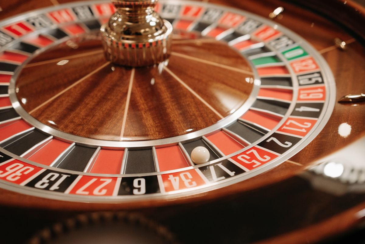 Close-up of a spinning roulette wheel with the ball in play, one of the table games on licensed casino apps