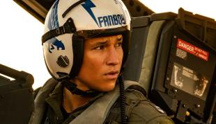 danny ramirez in top gun maverick wearing helmet