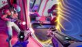 Splitgate 2 image with a couple of players shooting at an enemy through a portal.